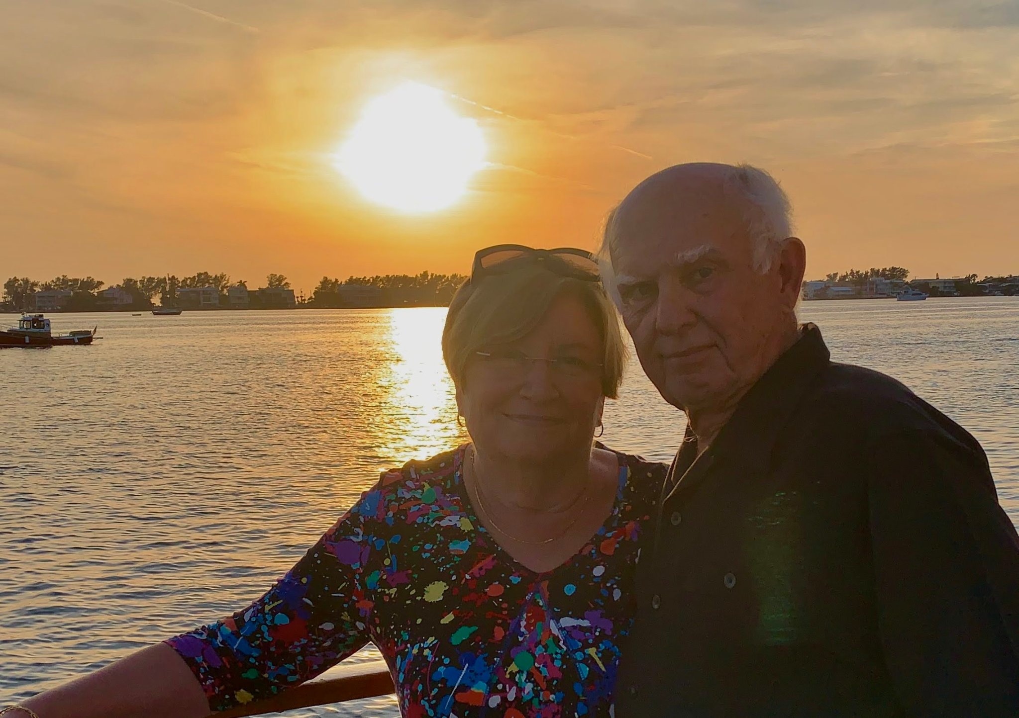 Jane and Gid enjoying a beautiful sunset on the water